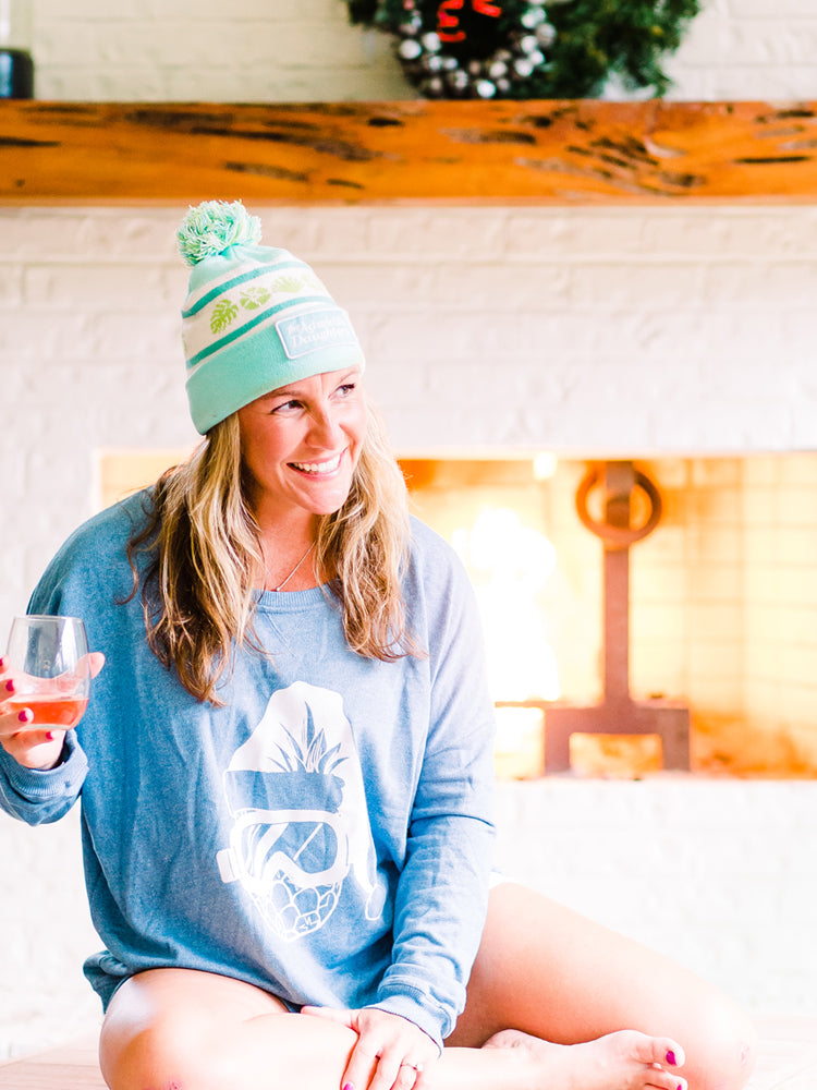 corkie coastal holiday collection with fireplace and pineapple santa and wine lovers